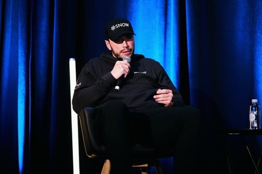 Josh Snow speaking on stage